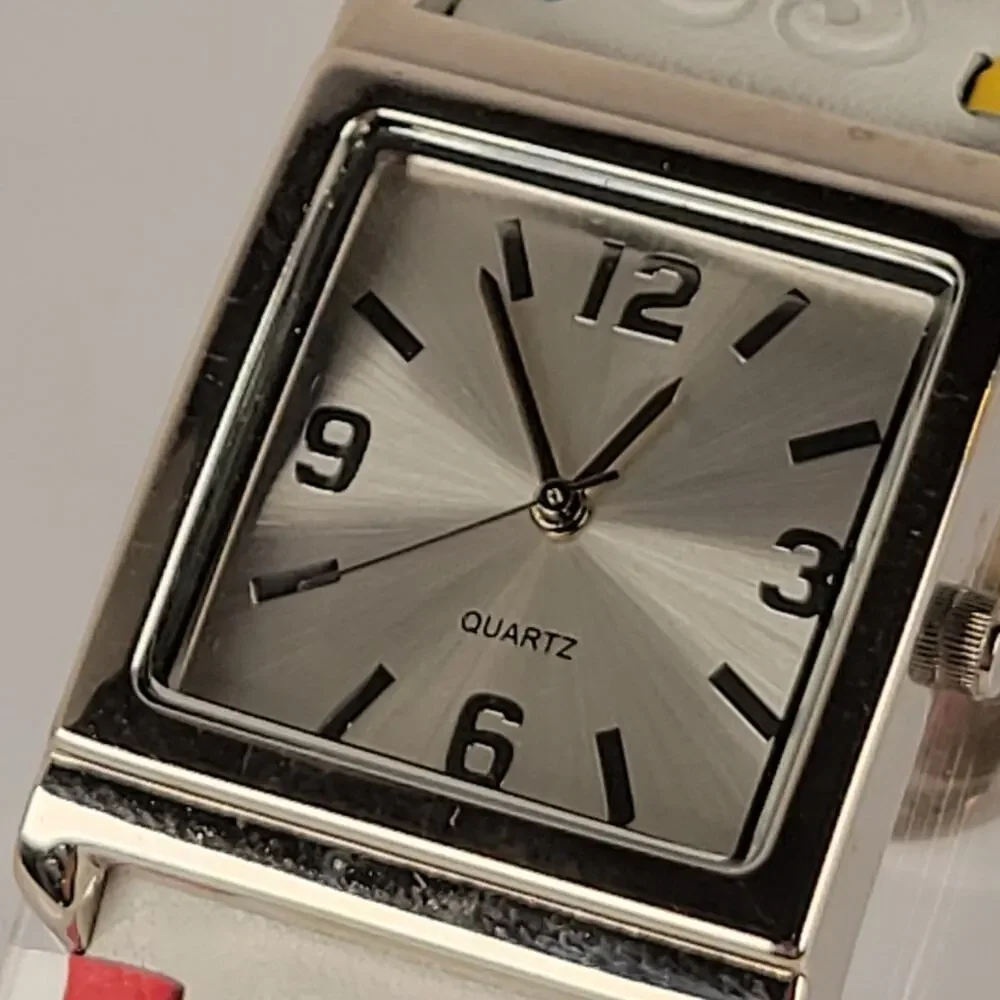 Silver Quartz Watch with Embossed Cuff White Leather Strap and Multicolor Design